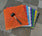 Colorful interlocking floor grates for car washes, garages, pools; shown with rubber mallet for installation
