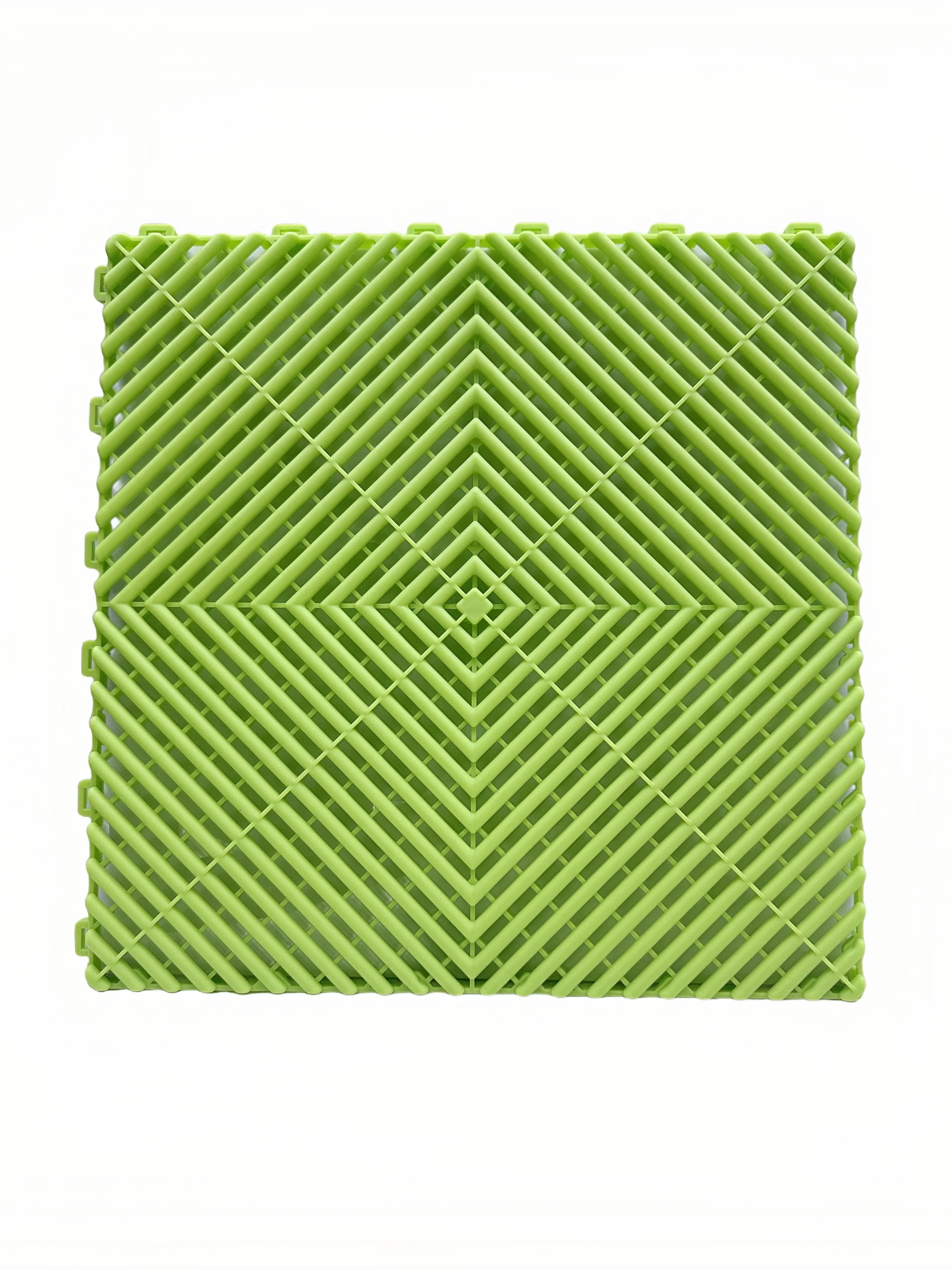 Green interlocking floor grate tile for car washes, garages, or playgrounds with diamond pattern