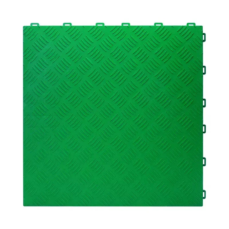 Green interlocking floor grate with diamond tread pattern for car washes, garages, and playgrounds