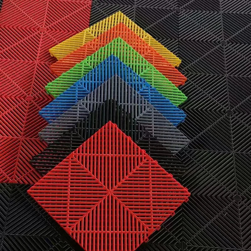 Colorful interlocking floor grates for car washes, garages, pools; durable plastic drainage tiles