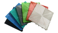 Colorful interlocking plastic floor grates for car washes, garages, pools, and playgrounds